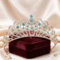 Exquisite gold tiara with sparkling blue rhinestones and clear crystals for bridal styling. - KC Gold With Lake Blue