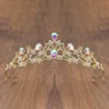 Close-up detail of a gold children princess crystal tiara with sparkling rhinestones and gems. - Gold with AB Rhinestone