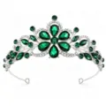 Close-up of gorgeous silver bridal tiara featuring sparkling deep green rhinestone crystals. - Silver with Green Zircon