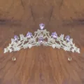 Detail view of a silver children princess crystal crown with purple rhinestones for performance. - Silver with Purple Rhinestone