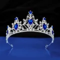 Exquisite silver rhinestone bridal tiara detail, sparkling blue crystal crown display. - Silver with Royal Blue