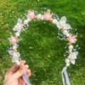 Delicate pink floral hair wreath detail, featuring pearls and ribbons for girls' parties and events. - Pink