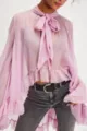 Detailed view of sheer lavender chiffon blouse with bow-tie neck and bell sleeves - S / Pink