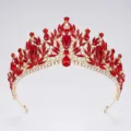 Baroque red crystal crown tiara detail shot showing exquisite gemstone cutting and golden metal base. - Gold + Red Rhinestone
