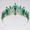 Detailed view of luxury baroque green crystal tiara, exquisite gold-tone bridal crown. - Gold + Green Rhinestone