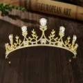 Golden bridal tiara with sparkling rhinestones and elegant leaf design for wedding hair accessories. - Gold Standard