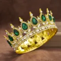 Exquisite baroque gold crown featuring stunning emerald green teardrop gems and sparkling rhinestones. - Gold with Green Rhinestone