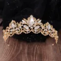 Detailed view of the sparkling crystal tiara, showcasing intricate marquise rhinestones. - Gold