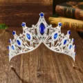 Detailed close-up view of the luxury Baroque silver bridal tiara with blue stones. - Silver with Royal Blue
