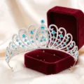 Close-up detail of silver rhinestone crown with sparkling blue crystals in velvet gift box - Silver with Lake Blue