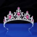 Close-up detail of silver crystal tiara with pink gems, exquisite bridal hair accessory for wedding. - Silver + Rose Red Rhinestone