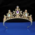 Gold bridal tiara close-up featuring iridescent crystal rhinestones and fine sparkling details. - Gold + AB Rhinestone