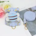 Close-up of plush bee decoration on blue corduroy pet harness and matching leash set - 1.2m M / Blue