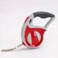 Red and grey retractable dog leash with ergonomic handle and lock button for safe walking - 3 Meters Boxed / Red