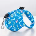 Retractable blue dog leash featuring colorful paw prints and bone patterns for small pets - Blue Dog Bone