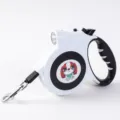 Retractable dog leash with LED light and cartoon dog design in white and black - White