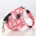 Automatic retractable dog leash featuring a cute pink cartoon pet pattern for outdoor walking - Dog Head Style Pink Animal
