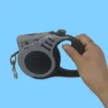 Ergonomic gray retractable pet leash featuring LED light and decorative bone patterns - Gray