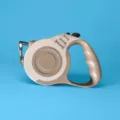 Retractable dog leash in tan color with ergonomic handle and automatic extension - 5 Meters Card Packaging / Bone Coffee