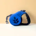 High-quality blue retractable pet dog walking leash with ergonomic handle and metal clip - Ginkgo Leaf Royal Blue
