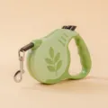 Green retractable dog leash with leaf pattern and ergonomic handle for pets - Leaf Dark Green