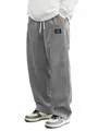 Close-up of men's gray corduroy casual pants with loose fit and drawstring. - S / Bottoms / Gray