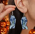 Detailed view of coffin-shaped acrylic earrings featuring spooky skull and potion graphics - Black Coffin Skull Style (WEH3436)
