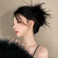 Elegant black ostrich feather hair claw clip with pearl necklace detail, perfect for chic styling. - Black