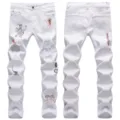 Men's white ripped stretch slim straight fit jeans featuring stylish graffiti print details. - 28 / Bottoms / White