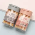 Portable bamboo toothpicks in clear containers featuring pink and grey flip lids - Flip Top - Double Pointed
