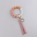 Silicone bead keychain bracelet with leather tassel, stylish wristlet for keys and bags daily use. - Pink