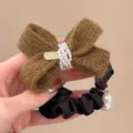 Accessorio per capelli con elastico fiocco lavorato a maglia autunno perle nero - Verde