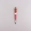 Christmas beaded ballpoint pen with cute silicone gingerbread man topper and festive red white gradient. - Bow Tie Gingerbread Man