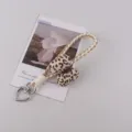 Cute leopard print bow keychain and woven phone strap, stylish accessory for daily use. - Milk Coffee