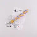Handgemaakte gevlochten telefoonkoord met paarse gele touwen, parels en zilveren strik. - Geel en Paars