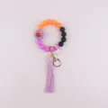 Halloween silicone beaded wristlet keychain with cute pumpkin charm and stylish tassel. - Purple Flower
