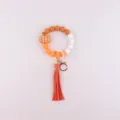 Halloween silicone beaded bracelet keychain with pumpkin charm and leather tassel for women. - Pumpkin