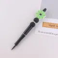 Creative handmade silicone spider web beaded pen Halloween gift ballpoint pen detail view - Green