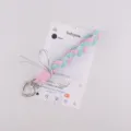 Handgemaakte gevlochten telefoonkoord en tasbedel met zilveren strik stijlvol accessoire - Groen en Roze