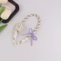 Handgemachte geflochtene Handykette mit Stern Anhänger und lila Schleife für Taschen. - Beige