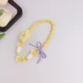 Handgemachte gelbe geflochtene Handykette mit Stern und lila Schleife für Taschen. - Gelb