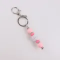 Pink silicone bead keyring with sparkle rhinestone ball charm, stylish bag pendant accessory. - Pink