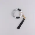 Silicone beaded wristlet keychain with black leather tassel and cross pattern beads variant. - Black