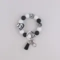 Siliconen kralen armband sleutelhanger met koeienprint kralen, hartbedel en zwarte kwast. - Zwart Wit Hart