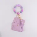 Llavero pulsera de cuentas de silicona morado tarjetero monedero con lazo y borla. - Púrpura