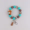 Westerse cowboy siliconen kraal armband sleutelhanger met kwast en metalen hardware accessoires. - Koffiebruine kabouter