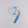 Silicone bead wristlet keychain with blue tassel and floral charm for stylish women daily use. - Blue