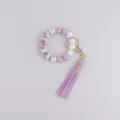 Silicone beaded wristlet keychain with floral printed beads and stylish leather tassel pendant. - Purple