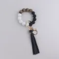 Silicone and wooden bead wristlet keychain with black leather tassel, stylish bracelet style. - Black