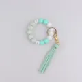 Silicone beaded keychain bracelet with leather tassel fashion wristlet accessory for women. - Green